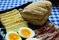 Bun, bacon, cheese and hard boiled eggs Royalty Free Stock Photo