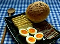 Bun, bacon, cheese and hard boiled eggs Royalty Free Stock Photo