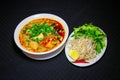 Bun Rieu or Vietnamese vermicelli noodle soup with milled crab m