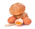 Bun with seeds and broken egg Royalty Free Stock Photo