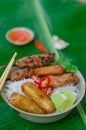 Bun thit nuong - Vietnamese grilled pork and rice noodles: It is a mix of vermicelli noodles, grilled pork, spring rolls, eaten Royalty Free Stock Photo