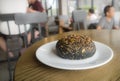 Bun on white plate in coffee shop cafe Royalty Free Stock Photo