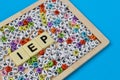 Colorful alphabet beads and square letters with text INDIVIDUALIZED EDUCATION PROGRAM