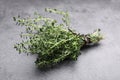 Bunch of aromatic thyme on grey table, closeup. Fresh herb Royalty Free Stock Photo
