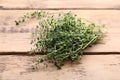 Bunch of aromatic thyme on wooden table, closeup. Fresh herb Royalty Free Stock Photo
