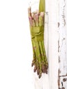 Bunch of asparagus hanging on a door Royalty Free Stock Photo