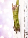 Bunch of asparagus hanging on a door Royalty Free Stock Photo