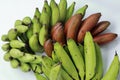 Bananas on white background. Healthful red banana collection. Ripe bunch of banana