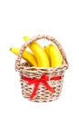 Bunch of bananas in a basket isolated on white Royalty Free Stock Photo