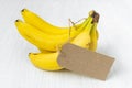 Bunch of bananas with blank paper tag Royalty Free Stock Photo
