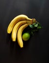 Bunch of bananas on a dark background. Composition.