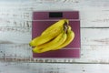 Bunch of bananas on digital body weight scale