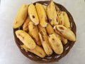 Bunch Bananas fruit on a brown plate ,in the room Royalty Free Stock Photo