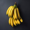 a bunch of bananas on a gray background