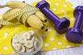 Bunch of bananas, measurement tape and dumbbells