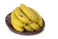 A bunch of bananas and a sliced banana with oats in a jar on the table. Royalty Free Stock Photo