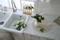 Bunch of beautiful fresh jasmine flowers in kitchen, above view Royalty Free Stock Photo