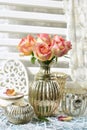 Bunch of multicolor roses in shabby chic style interior