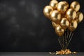 Bunch of big golden balloons objects for birthday party isolated on a black background Royalty Free Stock Photo