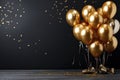 Bunch of big golden balloons objects for birthday party isolated on a black background Royalty Free Stock Photo