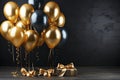 Bunch of big golden balloons objects for birthday party isolated on a black background Royalty Free Stock Photo