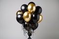 A bunch of black and gold helium balloons Royalty Free Stock Photo