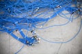 Bunch of blue cables with connectors Royalty Free Stock Photo