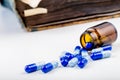 Bunch of blue pills with glass ampoules Royalty Free Stock Photo