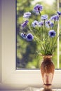 Bunch blue summery flowers on window Royalty Free Stock Photo
