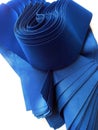 A bunch of blue velvet cloth insulated on a white background.