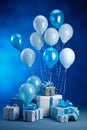 Bunch of blue and white balloons and presents on blue background with blue wall