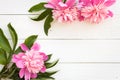 Bunch, bouquet of pink peonies on a wooden background. Frame of flowers Royalty Free Stock Photo