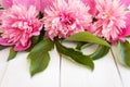 Bunch, bouquet of pink peonies on a wooden background. Frame of flowers Royalty Free Stock Photo