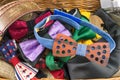 Bunch of bow ties and male accessories in a box