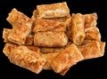 Bunch of Breaded Cheese and Ham Pancake Rolls Isolated on Black Background