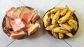 Bunch Breads and Bananas on a two brown plate ,in the room Royalty Free Stock Photo