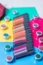 A bunch of bright lipsticks, eyeshadow colorful bright background, professional cosmetics, makeup, close-up