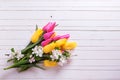 Bunch of bright yellow and pink spring tulips and apple tree flo Royalty Free Stock Photo