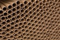 A bunch of brown industrial paper core. A lot of paper cores or paper tubes. Royalty Free Stock Photo