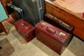 A bunch of brown suitcases. Antique luggage