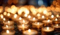 A bunch of candles are lit and arranged in a circle Royalty Free Stock Photo