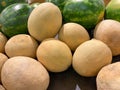 A bunch of cantalopes in a bin Royalty Free Stock Photo