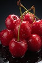 A bunch of cherries sitting on top of a black surface. Generative AI image. Royalty Free Stock Photo