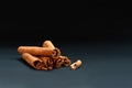 Bunch of cinnamon sticks on dark background