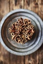 Bunch of Cinnamon sticks on a metallic rustic plate