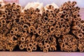 Bunch of cinnamon sticks for sale on counter top at the Christmas market. Healthy aromatic spice used in cooking and Royalty Free Stock Photo