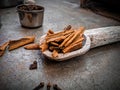 Bunch of cinnamon strips on a wooden spoon