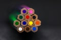 bunch of clour pencils coming trough dark Royalty Free Stock Photo