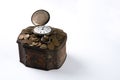 Bunch of coins with a pocket watch on top of Vintage jewelry box Royalty Free Stock Photo