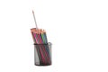 Bunch of Colored Wooden Pencils Placed Together in Metal Round Holder. With One Standout Pencil. Isolated Over White